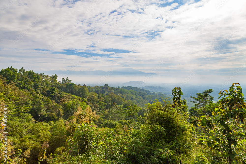 Fototapeta premium View to Gunung Merapi, Merbabu, Borobudur from Punthuk Setumbu viewpoint near Yogyakarta city, Central Java, Indonesia