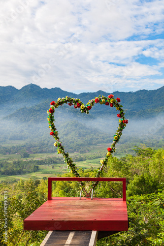 Heart photoframe at Punthuk Setumbu viewpoint near Yogyakarta city, Central Java, Indonesia photo