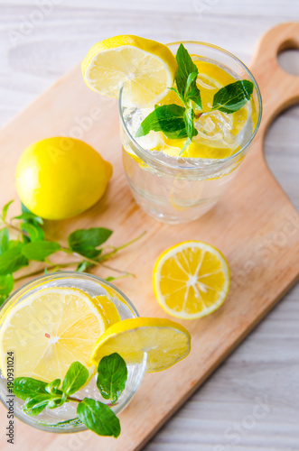 Glasss of mojito with lemon and drinking straw © Elnur