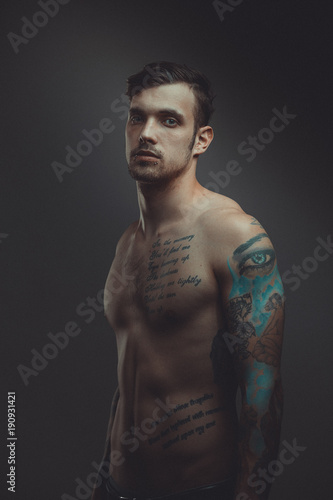 Young handsome man with tattoos