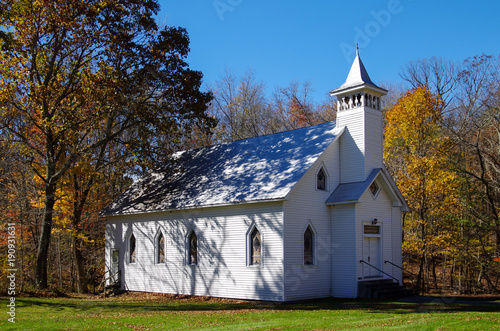 White Country Church in the Autumn Woods