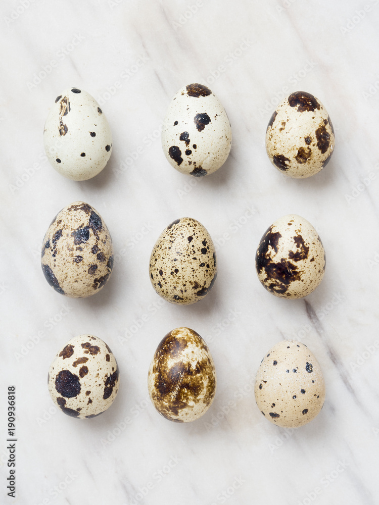 Quail eggs on a marble background