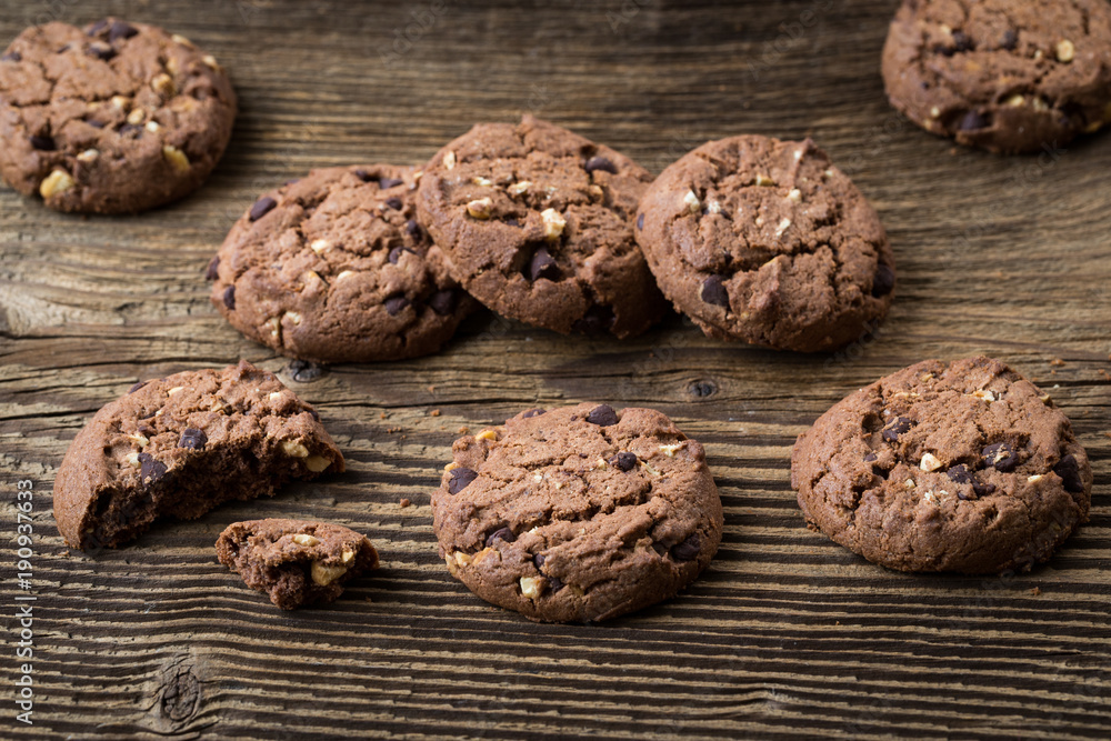Chocolate cookies on wooden table. Chocolate chip cookies. Sweet biscuits. Homemade pastry. Chocolate cookies on wooden table. Chocolate chip cookies. Sweet biscuits. Homemade pastry.
