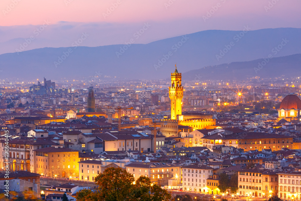 Famous Arnolfo tower of Palazzo Vecchio on the Piazza della Signoria at beautiful sunset in Florence, Tuscany, Italy
