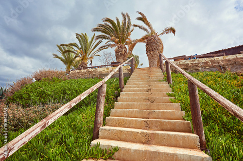 Wooden path down to the beach and ocean. photo