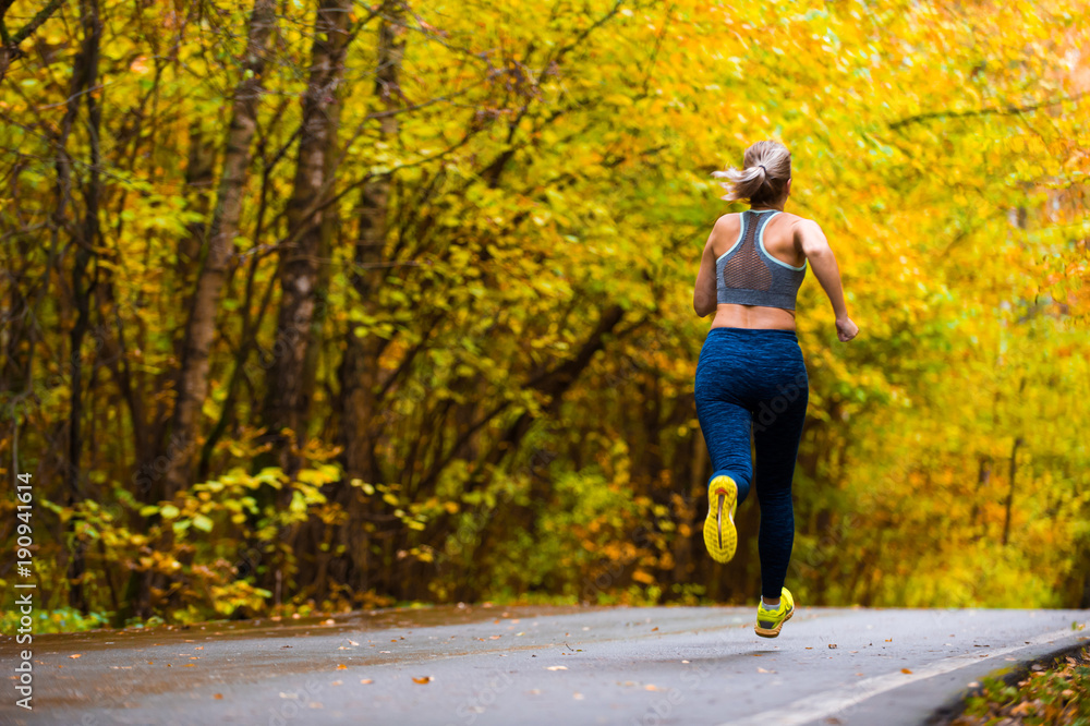 Woman running in the autumn park Woman running in the autumn park