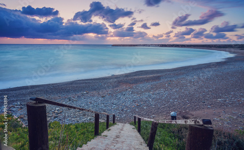 Wooden path down to the beach and ocean. photo