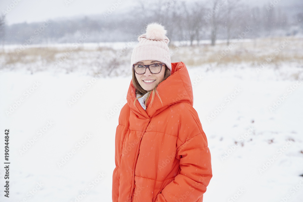 Woman portrait in snowy landscape