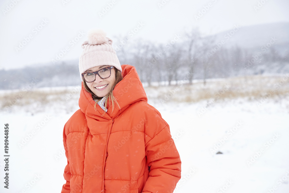 Woman portrait in snowy landscape