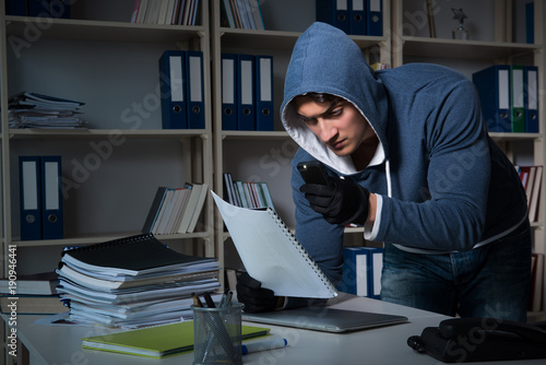 Tableau sur toile Young man in industrial espionage concept