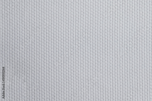 Texture of cool polyester fabric. Background of white textile