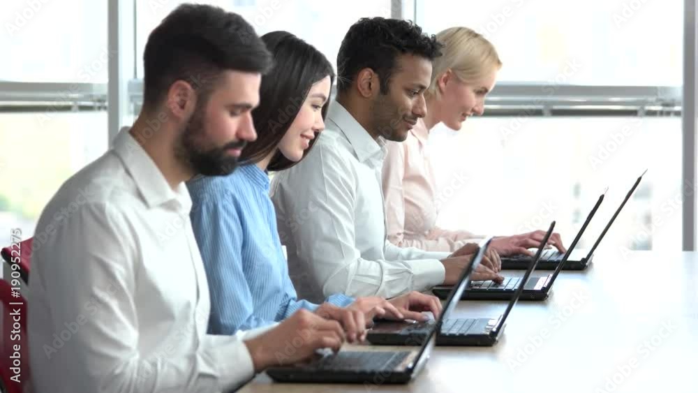 Indian man enjoying his job. Four colleagues co-workers. Indian man enjoying his job. Four colleagues co-workers.