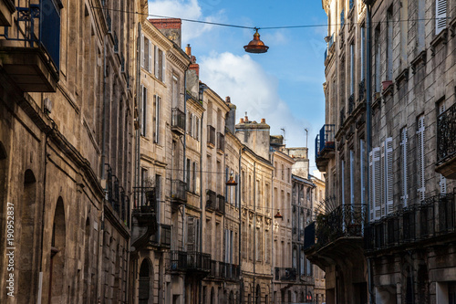 Facade of medieval buildings in a street in the city center of Bordeaux  France. These buildings are typical of the Southwestern French architecture