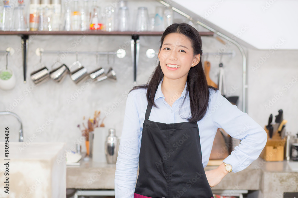 Portrait of beautiful young barista, asian woman is a employee standing in counter coffee shop, service concept. Portrait of beautiful young barista, asian woman is a employee standing in counter coffee shop, service concept.