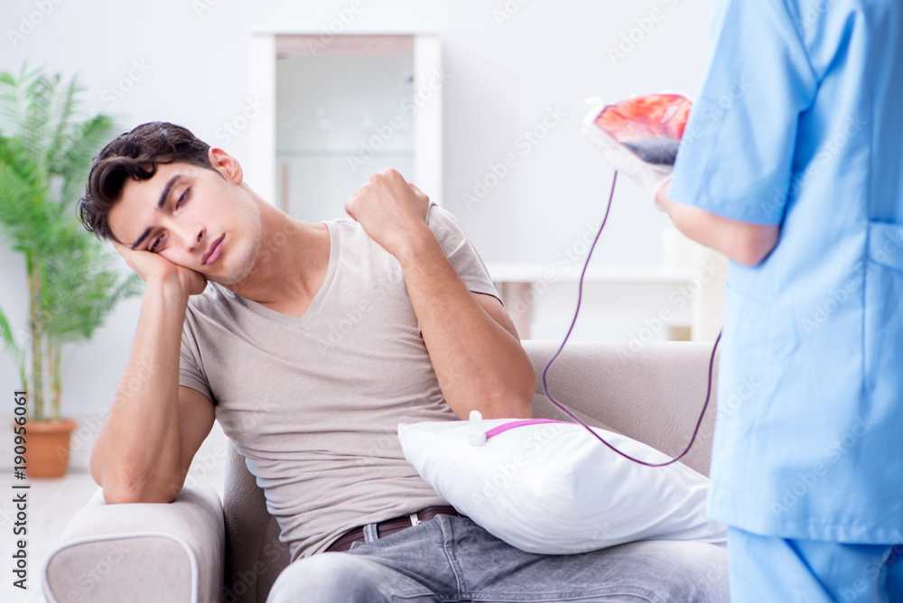 Obraz premium Patient getting blood transfusion in hospital clinic