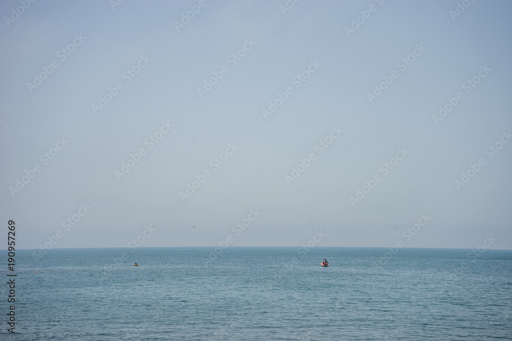 Calm and serene ocean  with a lonely boat at Malaga, Spain, Europe