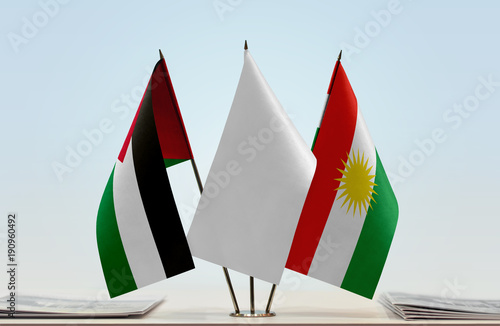 Flags of Palestine and Kurdistan with a white flag in the middle