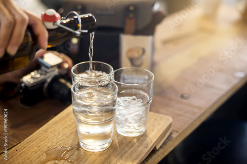 Water in a glass, selective focus