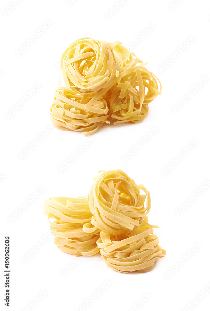 Uncooked fettuccine pasta isolated Uncooked fettuccine pasta isolated