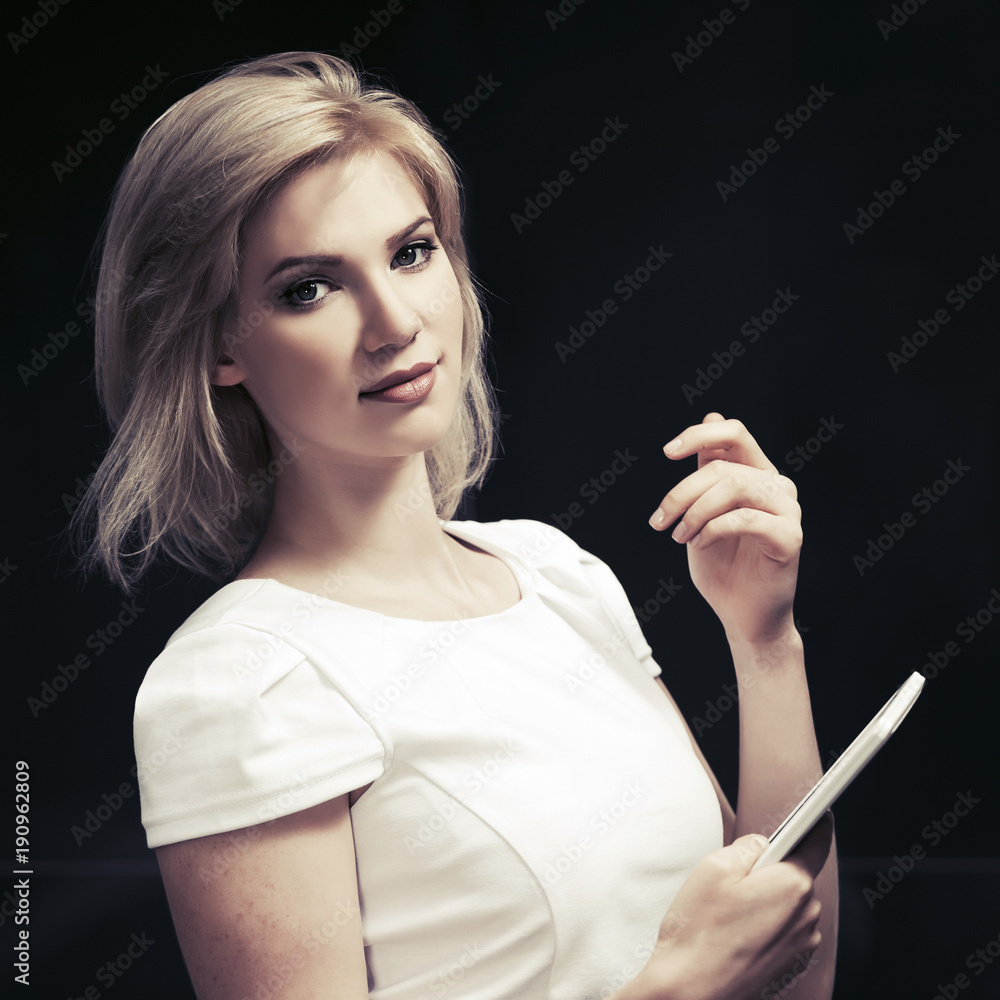 Fototapeta premium Young blond fashion woman using digital tablet computer