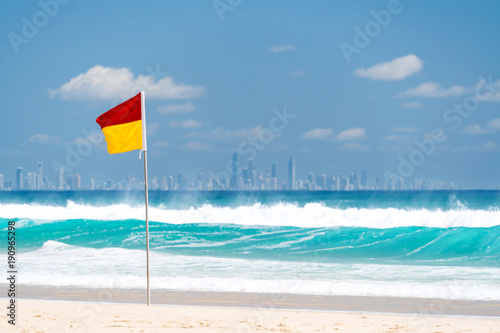 Surf lifesaving flag on a beach at Coolangatta on the Gold Coast, Queensland, Australia.