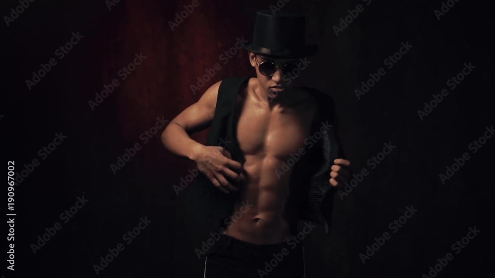 Man in a hat and glasses dances Man in a hat and glasses dances