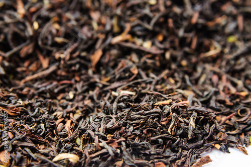 Background of dry black tea with flavors