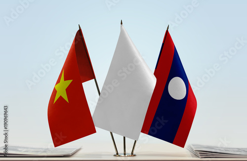 Flags of Vietnam and Laos with a white flag in the middle