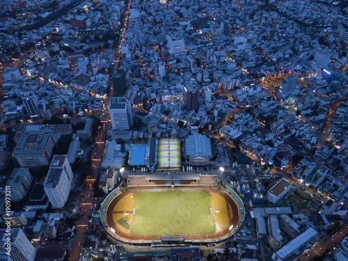 Drone night view of stadium with tennis courts