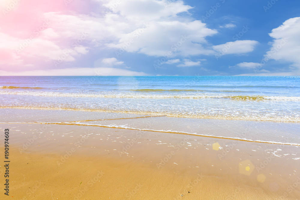 The sea and the beach under the blue sky and white clouds The sea and the beach under the blue sky and white clouds