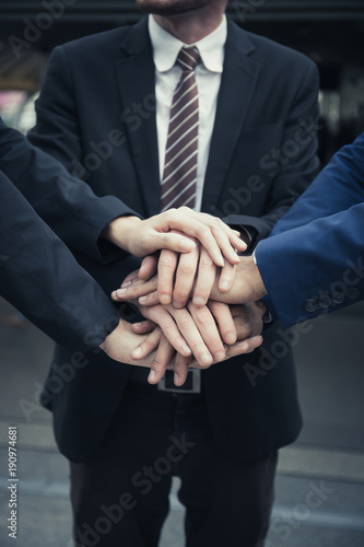 Group of Business Partners Team with hands together. People with business team stacking hands together.