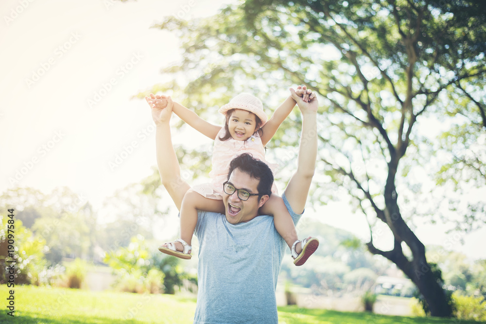 Father gives her daughter piggyback, happy time family. Father gives her daughter piggyback, happy time family.