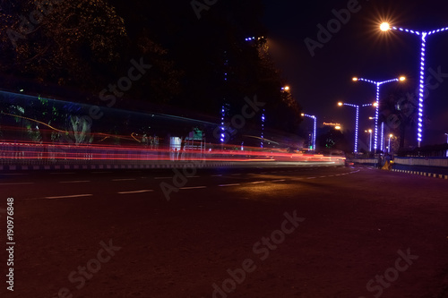 Car Light trails on a city street in a night © suman