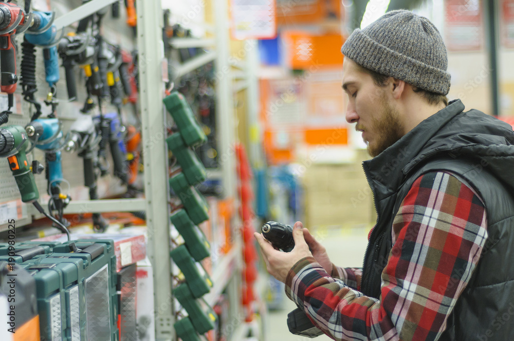 Man in a hardware store Man in a hardware store