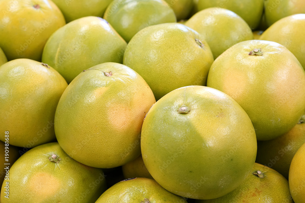 Close up on fresh grapefruit in pile Close up on fresh grapefruit in pile