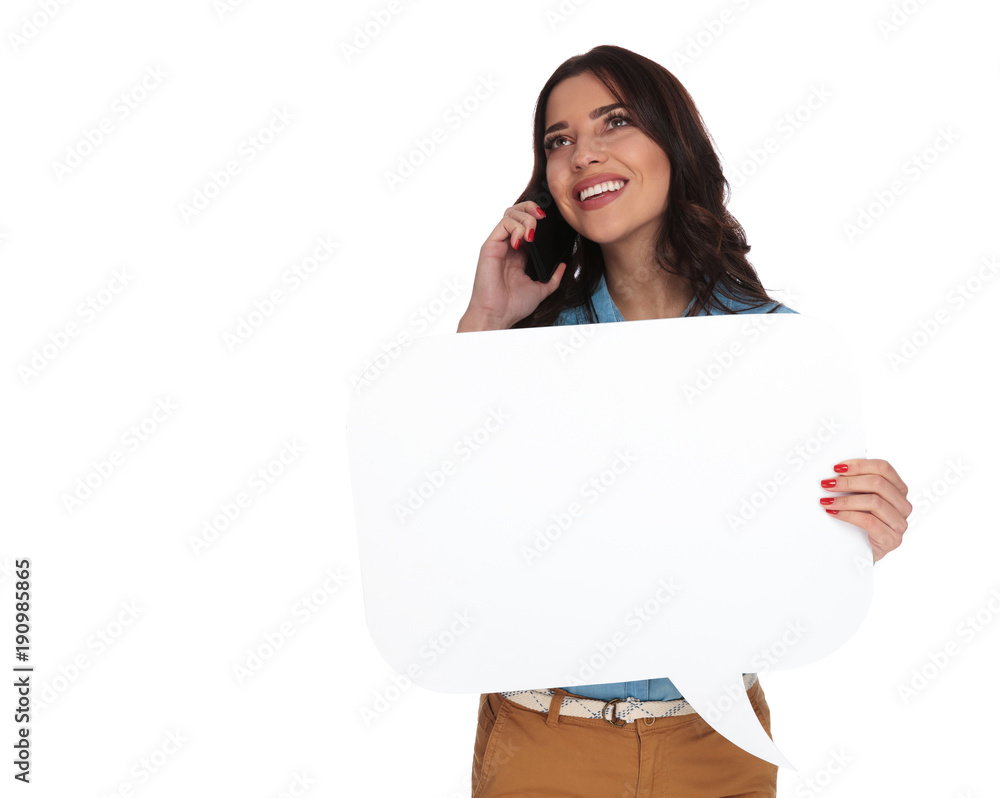 happy woman talking on the phone while holding speech bubble happy woman talking on the phone while holding speech bubble