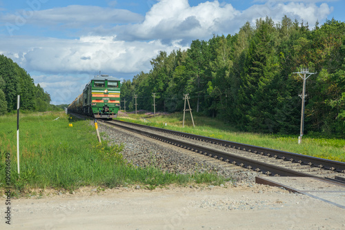 Railway with train. Sky and sunny day. photo