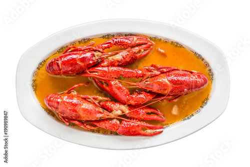 Crayfish in sauce. The main ingredients are cooked craysfish, onion, pepper, garlic, tomato, bay and olive oil. White isolated. Top view.