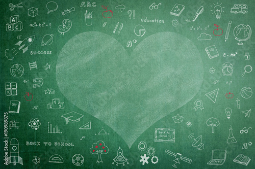 Doodle freehand white chalk drawing on green chalkboard with heart copy space for Educational back to school and teacher’s day concept photo