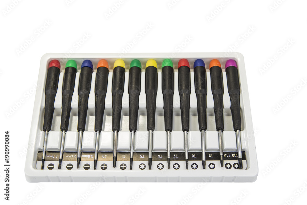 Set of pricise screwdrivers in the box on the white Set of pricise screwdrivers in the box on the white