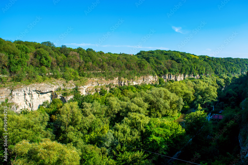 Photo of big green river canyon in Kamyanets-Podilsky