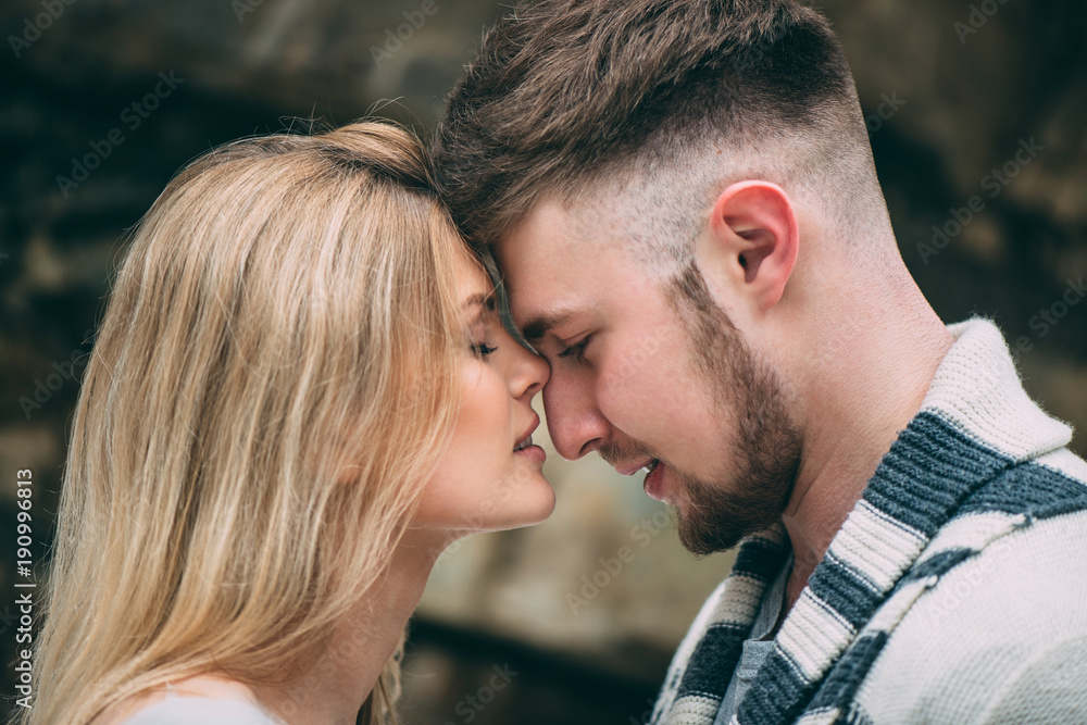 Young pretty pair of lovers. Winter. Date. A pair of lovers on a date in the mountains. Young pretty pair of lovers. Winter. Date. A pair of lovers on a date in the mountains.