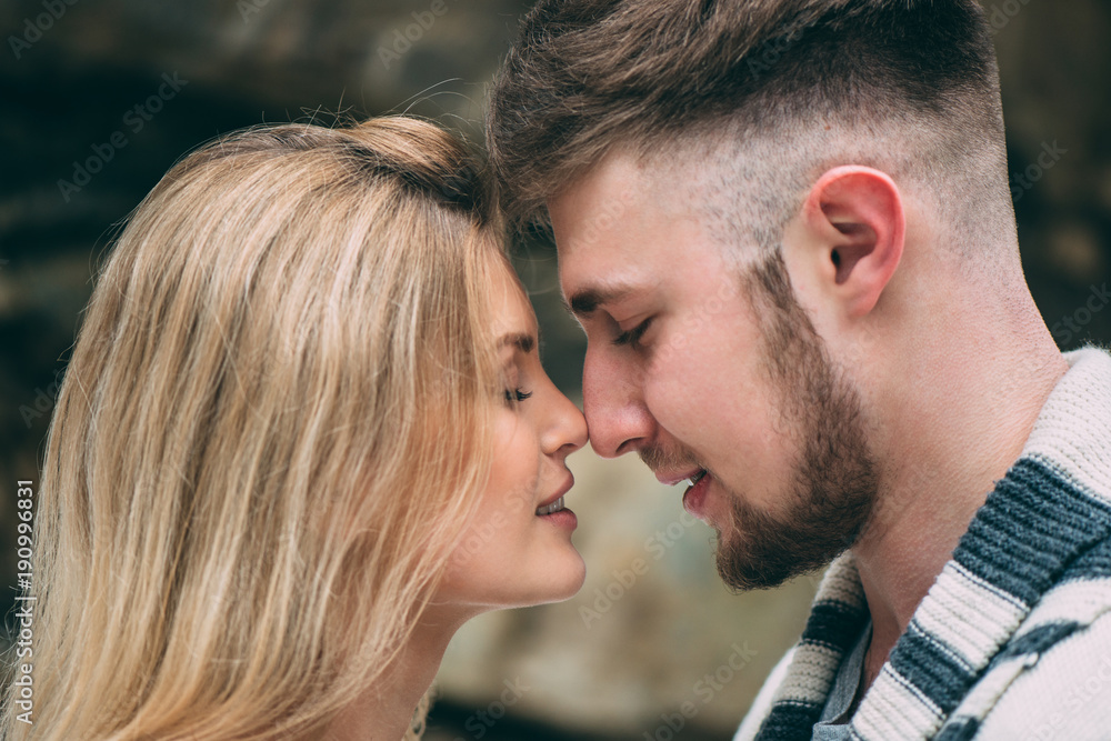 Young pretty pair of lovers. Winter. Date. A pair of lovers on a date in the mountains. Young pretty pair of lovers. Winter. Date. A pair of lovers on a date in the mountains.