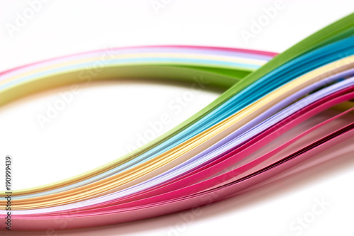 Colorful paper stripes on white background; abstract lines background