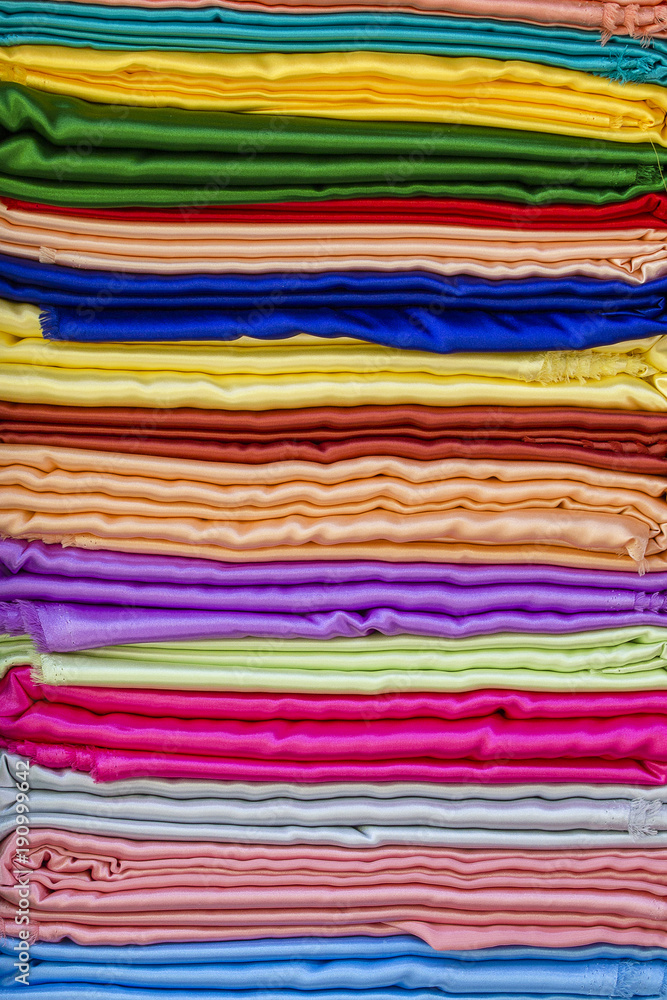 Heap of cloth fabrics at a outdoor street market in India