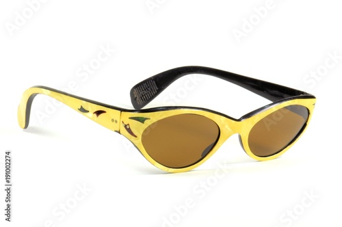 Beautiful vintage yellow sunglasses for woman closeup isolated on white. 1960s.