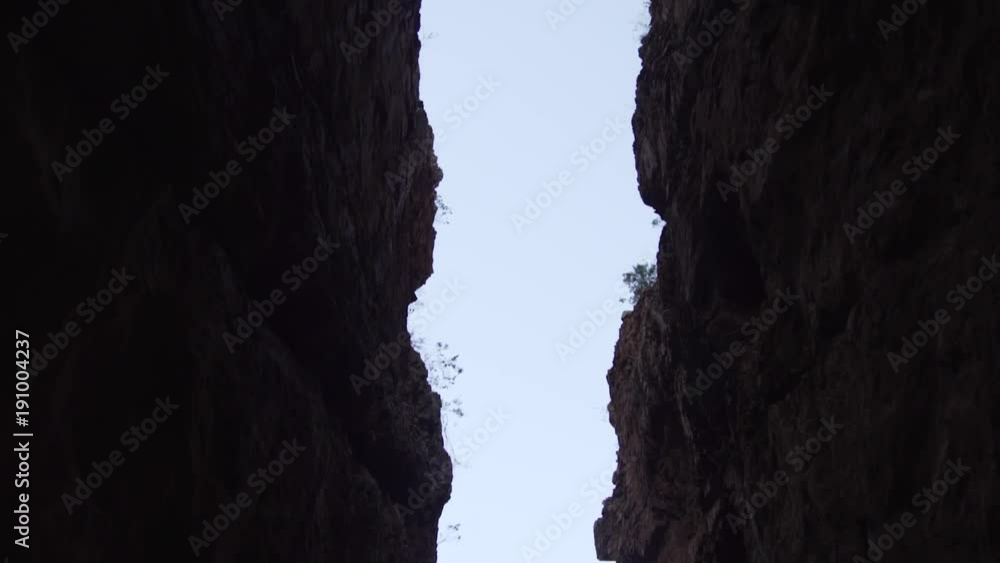 Skyward shot red rock crevice in Australian outback Skyward shot red rock crevice in Australian outback