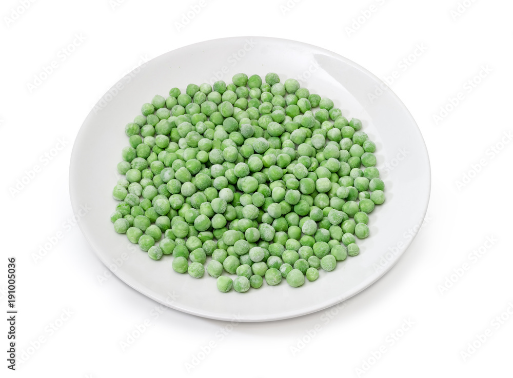 Frozen green peas on dish on a white background Frozen green peas on dish on a white background