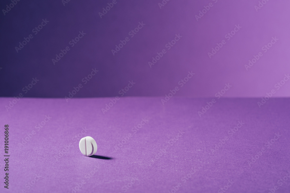close up view of medicine on purple background close up view of medicine on purple background