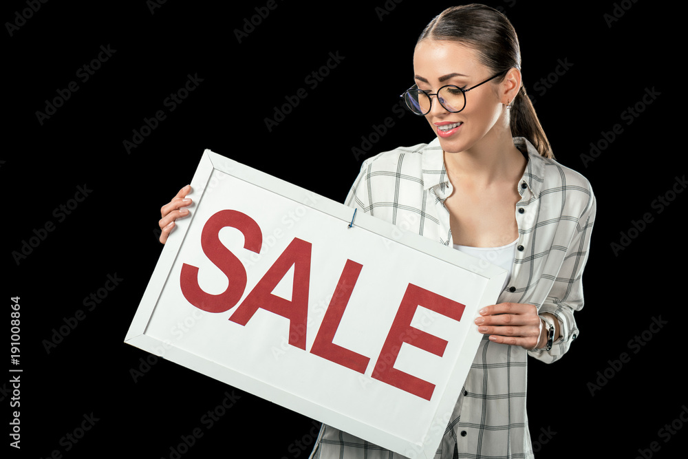 beautiful girl holding sale sign, isolated on black beautiful girl holding sale sign, isolated on black